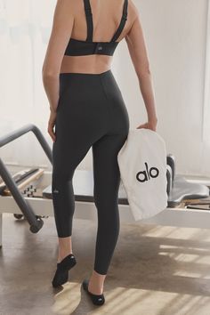 Done in stretchy, sheeny Airlift with a bonded, extra-high-rise waist, these leggings conform to your figure like a glove. As for the ⅞-length legs, they’re perfect for petites or an above-the-ankle fit. Pair them with a sweatshirt and the matching Strength Bra for a look you’ll keep in heavy rotation. Compressive Alo Yoga Pants For Pilates, Alo Yoga Compressive Yoga Pants For Pilates, Black Compression Leggings By Alo Yoga, Black Compressive Alo Yoga Leggings, Sleek Compression Activewear By Alo Yoga, Alo Yoga Tight Sporty Leggings, Tight Sporty Alo Yoga Leggings, Alo Yoga Sporty Tight Leggings, Alo Yoga Sleek Compressive Activewear