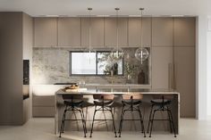 a modern kitchen with marble counter tops and bar stools