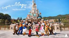 the mickey mouses are posing for a photo in front of disney's castle