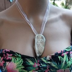 This Necklace It's Made With A Stone Seashell Very Unusual Found On The Beaches Of Myrtle South Carolina It's Been Adorned With A White Ribbon And Double Corded Silver Clasp It Can Be Worn 4 Dress Occasion Or Casual. No Two Seashells Are Ever The Same. The Seashell Seems To Have A Little Bit Of Mother Pearl Type Of Listening To It When The Sun Hits It And Yet Erosion Has Caused Another Texture On It As Well It Has An 8in Drop From Neck To Seashell Made Exclusively For My Salon Elegant Shell Necklace For Summer Beach Occasions, Elegant Shell Necklace For Summer Beach, Elegant Shell Necklace For Summer, Unique Beach Necklaces For Summer, Unique Summer Beach Necklaces, Types Of Listening, When The Sun Hits, Dress Occasion, Seashell Necklace