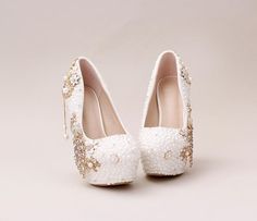 Handmade High Heels Round Toe Pearls Crystal Wedding Shoes, S0038 Description Platform Height: 2.5cm Heels: 10, 12, 14cm Toe Shape: Round Toe Inside Material: Leather Outside Material: Rhinestone, Crystal, Pearls Size If your feet are fat, please consider one size bigger. Package: Pack with box Delivery Time: 2-3 weeks including weekend. Return Policy: Shoes are final sales, so we don't accept the return or exchange of it once sold. Pearl White Pointed Toe Wedding Shoes For Party, Pearl White Round Toe Heels For Evening, Pearl White Evening Heels With Round Toe, Cream Round Toe Wedding Shoes, Cream Court Shoes For Party With Round Toe, Elegant Pearl White Round Toe Heels, Cream Court Shoes With Round Toe For Party, White Almond Toe Heels For Bridal Shower, Pearl White Closed Toe Wedding Shoes For Evening