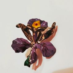 Lovely vintage enamel brooch in the shape of an Iris Flower. This listing is for ONE brooch, but I do have two available (see last photo). Please message me for pricing on both brooches. Material: gold tone metal, enamel Size: 1.5 inches x 1.25 inches Colors: gold, purple, green, yellow Pin on back, works well. In good vintage condition. Will be shipped in a small organza or velvet jewelry bag or jewelry box. I am happy to add a gift message (free) and/or gift wrap (add during the checkout process). Floral Enamel Brooch Pin, Enamel Flower Brooch Pin, Flower Shaped Enamel Brooch Pin, Flower Shaped Enamel Brooch, Flower Shaped Enamel Pin, Flower Lapel, Flower Lapel Pin, Iris Flower, Jewelry Flower