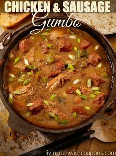 chicken and sausage gumbo in a cast iron skillet with bread on the side