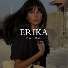 a woman with long dark hair is holding a straw bag and posing for the camera