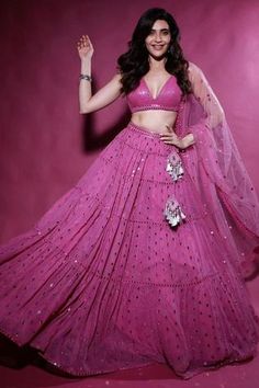 Dark blush lehenga with all-over mirror hand embellishments and gathered tiers. Comes with plunging neck blouse and cutwork border dupatta.
Components:3
Embroidered
Neckline:V Neck
Sleeve Length:Sleeveless
Fabric:  Georgette, Net
Color:Pink
Cutwork border dupatta
Tiered lehenga
Kamar latkans
Cutout back
Plunging neck - Aza Fashions Vani Vats, Karishma Tanna, Dark Blush, Fashionable Tops, Stunning Gowns, Shirts Design, Effortless Elegance, Gorgeous Gowns, Latest Outfits