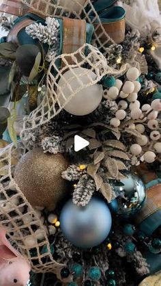 a christmas tree with ornaments on top of it and an ornament in the middle