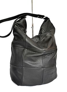 "Leather handbag Black leather purse Leather shouler bag Black leather bag Black shoulder purse Leather hobo bag purse Black leather hobo Slouchy leather bag Black slouchy bag Soft leather bag Women leather bag Leather hobo black This is a comfortable and capacious bag.Its simple and functional character allows you to fit everything you need inside throughout your entire day. It is voluminous yet neat, making it a great addition to a loose fitting and elegant clothing. This leather bag women is Modern Rectangular Hobo Bag With Leather Backing, Black Soft Leather Square Hobo Bag, Black Square Leather Shoulder Bag, Black Leather Hobo Bag For Daily Use, Black Hobo Bag With Leather Lining, Black Leather Hobo Shoulder Bag, Large Capacity Square Leather Hobo Bag, Black Soft Leather Hobo Crossbody Bag, Black Soft Leather Crossbody Hobo Bag