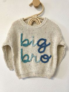 Our custom hand embroidered name sweaters are sure to look adorable on the sweet little one in your life!  Give them as gifts for baby showers, name announcements, first birthday's, Xmas gifts, and more!  Sweaters are a chunky knit and an oversized fit to wear as your baby grows.  These are perfect to wear in the fall, winter, or spring. Choose the color and size of your sweater in the above drop down.  Choose how many letters are in the name you want embroidered.  Fill in the personalization bo Cute White Sweater With Embroidered Text, White Cute Sweater With Embroidered Text, Cute Cotton Sweater With Embroidered Logo, Cute Crew Neck Sweater With Embroidered Logo, Cute White Sweater With Custom Embroidery, White Cute Sweater With Custom Embroidery, White Sweater With Custom Embroidery, Cute Winter Sweater With Embroidered Text, Levi Name