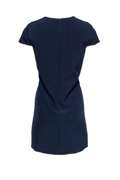 Whether it’s evening cocktails or a work lunch, this Milly dress has got you covered. With a feminine V-neck and cap sleeves, dress it up with sparkling jewelry or keep it casual with only a few delicate necklaces. The versatility within this piece is perfect for the busy woman. Size 8 Shell: 90% Polyester, 10% Elastane Lining: 100% Polyester Made in USA Concealed back zipper Lined Shift silhouette V-neckline Cap sleeve Bust 38” Shoulder to hem 33.5” Elegant Short Sleeve Dress For Night Out, Chic Cap Sleeve Mini Dress For Formal Occasions, Chic Cap Sleeve Formal Dress, Chic Formal Dress With Cap Sleeves, Elegant Blue Short Sleeve Knee-length Dress, Elegant Cap Sleeve Dress For Night Out, Elegant Navy Mini Dress With Short Sleeves, Elegant Navy Short-sleeved Mini Dress, Elegant Navy Short Sleeve Mini Dress