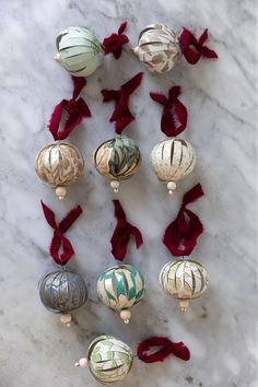 christmas ornaments are laid out on a marble surface