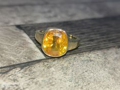 Yellow sapphire, also known as "Pukhraj" in Hindi, is a gemstone that belongs to the corundum family, just like blue sapphire. It is the yellow variety of corundum and is valued for its vibrant yellow color. Yellow sapphire is composed of aluminum oxide (Al2O3) with traces of iron that give it its yellow hue. The color of yellow sapphire can range from pale yellow to intense golden yellow. The most prized and valuable yellow sapphires typically exhibit a pure, vibrant yellow color without any hi Fine Jewelry Yellow Sapphire Ring Gift, Yellow Sapphire Ring Fine Jewelry Gift, Yellow Sapphire Solitaire Jewelry Gift, Yellow Sapphire Ring Jewelry Gift, Gift Yellow Sapphire Solitaire Jewelry, Gift Yellow Sapphire Birthstone Ring, Yellow Sapphire Gemstone Rings As Gift, Gift Yellow Sapphire Gemstone Rings, Gift Rings With Yellow Sapphire Gemstone