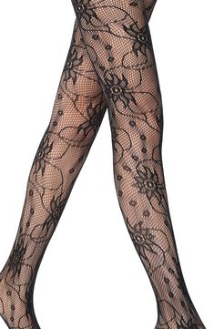 Spruce up your style with these dreamy fishnet tights brimming with lively floral detailing. Polyamide/elastane Hand wash, line dry Imported Summer Fishnet Fitted Hosiery, Fitted Fishnet Hosiery For Summer, Fitted Summer Fishnet Hosiery, Spring Lace Stretch Tights, Fitted Mesh Summer Tights, Spring Sheer Thigh High Tights, Fitted Thigh-high Net Stockings, Spring Fitted Lace Hosiery, Fishnet Lace Legwear