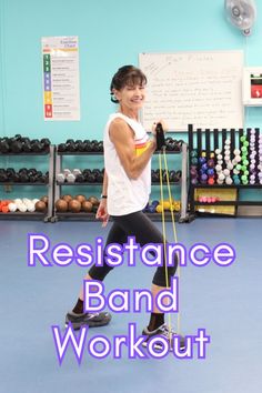 a woman holding a resistance band in a gym with the words resistance band workout on it