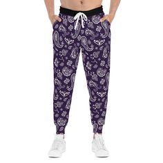 Introducing our exclusive Queen Dark Purple Bandana Print Joggers! These personalized jogging pants are designed to elevate your lounging and workouts with a touch of custom style. Crafted with meticulous attention to detail, these all-over-print joggers offer a cozy, unisex fit that ensures comfort and versatility. The cut & sew construction guarantees a higher quality product, both in terms of the materials used and the overall production standards. Made from a soft blend of 95% polyester and Purple Athleisure Sweatpants With Elastic Waistband, Purple Casual Activewear With Elastic Waistband, Casual Purple Activewear With Elastic Waistband, Casual Purple Gym Pants, Purple Athleisure Joggers For Loungewear, Purple Athleisure Joggers With Pockets, Casual Purple Activewear With Pockets, Purple Relaxed Fit Sporty Sweatpants, Casual Purple Sweatpants With Elastic Waistband