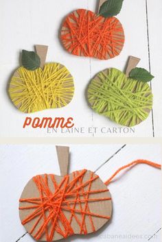 an image of yarn wrapped pumpkins on the side of a wooden board with string attached to them