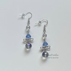 "Handmade Beaded Earrings ✿ Made with glass Czech beads, glass beads, and metal accents ✿ Silver, clear sky blue, iridescent clear, and iridescent deep grey ✿ The earrings are 2.25\" long Fish Hook Options ✿ The Titanium fish hook is hypoallergenic and ideal for sensitive skin ✿ The regular fish hook is made of nickel free metal, it is not hypoallergenic" Silver Glass Beaded Dangle Earrings, Silver Crystal Earrings For Jewelry Making, Silver Glass Bead Round Earrings, Silver Dangling Beads Glass Earrings, Silver Beaded Earrings With Round Glass Beads, Silver Glass Earrings With Dangling Beads, Silver Earrings With Dangling Glass Beads, Adjustable Silver Glass Beaded Earrings, Silver Glass Drop Crystal Earrings