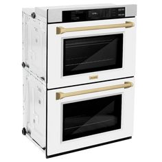 two white ovens side by side with gold handles