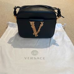 Brand New/ Never Used Comes With Dust Bag And Detachable Strap 7”Wx5.5”Hx3”D 18.5-20.5” Strap Drop Luxury Shoulder Bag With Logo Hardware, Designer Party Bags With Metal Logo, Designer Evening Bag With Metal Logo, Designer Evening Bags With Metal Logo, Luxury Rectangular Shoulder Bag With Metal Logo, Luxury Evening Shoulder Bag With Logo Hardware, Designer Bags With Logo Hardware For Party, Designer Party Bag With Logo Hardware, Black Shoulder Bag With Metal Logo For Everyday Luxury