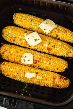 corn on the cob with butter and parmesan cheese in an air fryer