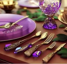 purple and gold place setting on a table