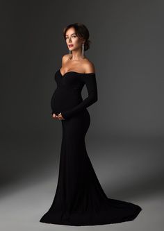 The Scarlet Gown features a fitted cut with an off the shoulders, long sleeves top. This comes with a shorter train, more suitable for studio use. MATERIAL / Stretchy Knit COVERAGE / Fully Line PROCESSING TIME / 2-3 WEEKS Black Formal Dress Maternity, White Outfit Maternity Photos, Black Maternity Dress Photoshoot, Pregnant Evening Dress, Black Dress Maternity Pictures, Black Maternity Pictures, Elegant Maternity Photos, Maternity Evening, Fall Maternity Photos