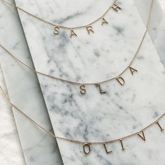 The 14kt AMELIA TEXT NECKLACE is a great necklace to wear solo or layered with multiple necklaces. Dainty and delicate, it features up to 6 letters hung on the chain and can be worn by the collarbone, or slightly higher as a choker. Letters measure 7.5mm in height. Necklace measures 16" with an adjuster at 15". This style is custom made to order. Please allow the full 4 weeks production lead time before it ships. Everyday Yellow Gold Initial Necklace With Custom Name, Yellow Gold Custom Name Necklace For Everyday, Everyday Yellow Gold Custom Name Necklace, Personalized 14k Gold Delicate Chain Necklace, Dainty Tan Necklace For Everyday, Dainty Gold Necklace With Custom Name, Everyday Gold Nameplate Necklace, Delicate Custom Name Necklaces For Everyday, Delicate Everyday Custom Name Necklaces