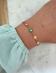 Beautiful multi-colored flower bracelet with a 14k gold filled clasp and jumprings. Can be made in an adult size or child length with extender. Child length is made with an extender to be approximately 5.25"-6.5". Giftbox included. Dainty Multicolor Flower Jewelry, Multicolor Dainty Jewelry With Flower Charm, Colorful Flower Shaped Jewelry For Gifts, Colorful Flower Shaped Jewelry Gift, Colorful Flower-shaped Jewelry For Gifts, Colorful Flower-shaped Jewelry Gift, Colorful Flower Bracelets As Gift, Colorful Flower Bracelets For Gifts, Colorful Flower-shaped Bracelets For Gifts