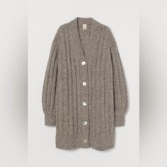 A Stunning Taupe Rib-Knit Cardigan In Soft Alpaca Wool. V-Neck, Shell Buttons At Front, Dropped Shoulders, And Long Sleeves. Ribbing At Neckline, Cuffs, And Hem. Seller Note: Very Oversized Fit. I Truly Don’t Want To Part With This Sweater But I Just Don’t Wear It. Hoping Someone Else Can Give It A Better Life! Measurements: Length From Collar To Hem: 38.5” Pit To Pit: 24.5” Sleeve Shoulder Seam To Wrist: 22” Fitted H&m Winter Cardigan, H&m Knit Outerwear For Winter, H&m V-neck Fall Outerwear, Alpaca Cardigan, Rib Knit Cardigan, Shell Buttons, Alpaca Wool, Just Don, Tan Brown