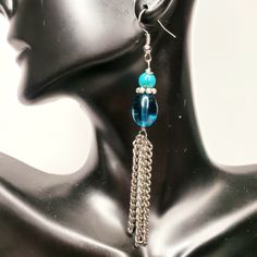 Blue/Aqua beaded Chain earrings Hang length Approx 5" . Please note these earrings are lightweight, but do have a slight weight to them. They hang low and buyers may want to consider the wearer's neck length ** Please note that all monitors show colors in slight variations Blue Metal Beaded Earrings Wire Wrapped, Blue Wire Wrapped Beaded Metal Earrings, Handmade Blue Beaded Metal Earrings, Elegant Beaded Chain Dangle Earrings, Blue Metal Earrings With Dangling Beads, Blue Metal Jewelry With Dangling Beads, Elegant Blue Beaded Chain Earrings, Blue Metal Beaded Dangle Earrings, Blue Beaded Long Drop Jewelry