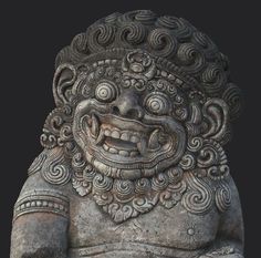 an ancient statue is shown against a black background and has swirly designs on it