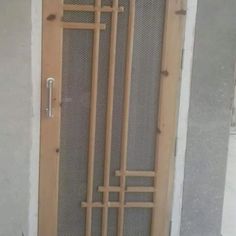 a wooden door with metal bars on it