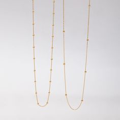 🌟 Elevate your style with our 14k solid gold satellite beaded ball chain necklace. This delicate and minimalist necklace features evenly spaced gold beads, making it perfect for layering or wearing alone. Ideal for everyday wear and special occasions, this timeless piece adds a touch of sophistication to any outfit. Perfect for birthdays, anniversaries, or just because. ✨ Perfect For:     Birthdays 🎉     Anniversaries 💕     Everyday Elegance 🌼 Order now to add a versatile and elegant piece t Minimalist Ball Chain Necklace With Round Beads, Minimalist Everyday Chain Necklace With Round Beads, Everyday Minimalist Chain Necklace With Round Beads, Everyday Minimalist Round Beads Chain Necklace, Minimalist Necklace With Ball Chain And Round Beads, Minimalist Ball Chain Necklace, Minimalist Chain Necklace With Round Beads, Minimalist Yellow Gold Beaded Necklace With Delicate Chain, Everyday Minimalist Ball Chain Necklace