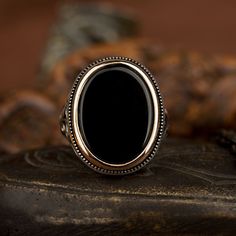 Onyx Black Flat Silver Ring For Men. Handmade in 925 sterling silver with agate stone. On the ring Oval flat black aqeeq - agate, onyx stone settled. Covered with yellow color rhodium plated frame. No gold or gold plating settled. Dimensions of stone is 20 mm x 15 mm. Average weight of Onyx Black Flat Silver Ring is 14 gr. (depends your ring size). Back side is closed. Classic and exclusive style. Stone Type Onyx, Aqeeq - Agate Stone Color: Black Stone Dimensions: 20 mm x 15 mm Stone Shape: Oval Silver Mens Rings, Rings Stones, Mens Jewerly, Mens Fashion Edgy, Men Rings, Sterling Silver Mens Rings, Shop Boutique, Pattern Ring, Detailed Ring