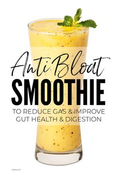 an orange smoothie in a tall glass with mint sprig on top and the words, anti bloat smoothie to reduce gas & improve gut health & digest