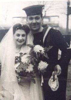 an old photo of a man and woman posing for a picture on their wedding day