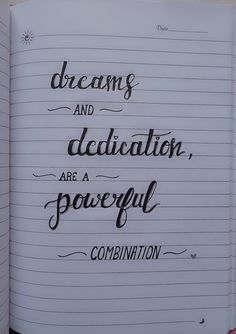 an open notebook with writing on it that says dreams and dedication are a powerful combination