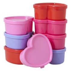 the stack of plastic cups has a heart shaped container in it's center and is pink, blue, purple, and orange