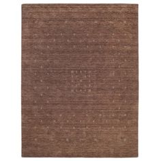 a brown rug with small dots on the top and bottom, it is made out of wool