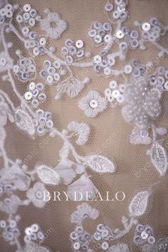 Shimmering sequins and fine pearls dotted on exquisite flowers and leaves, which embroidered on the soft tulle base. This beautiful bridal lace fabric will guide your way to glamour when be used as an overlay in wedding dresses or evening gowns. shown color light ivory/silver sold by the yard content nylon, polyester, pet elasticity no width 130cm washing instructions hand wash/drip dry Bridal Lace Fabric, Light Ivory, Soft Tulle, Bridal Pearls, Drip Dry, Bridal Lace, Flowers And Leaves, Lace Fabric, Washing Instructions