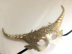 Whimsical dreamland collection Gold goddess horned masquerade mask C U S T O M I Z A T I O N Can be customized further. Get in touch for custom orders! S I Z E Adult size. S H I P P I N G - Processed same day or within 24 hours. 1-2 day guaranteed delivery, add item to cart, click shipping tab for rates. Pls leave a check out note with your need date & contact number Msg for delivery time frames (Include your state/country) C O N T A C T Text: 1-516-654-4643 Email: Lanai.ink6 [!at] gmail.com Gold Fantasy Festival Masks And Prosthetics, Gold Masquerade Mask For Mardi Gras Festival, Gold Masks And Prosthetics For Carnival Festival, Gold Fantasy Mask For Costume Party, Fantasy Masquerade Mask For Mardi Gras, Fantasy Masks For Carnival, Fantasy Gold Masks And Prosthetics For Halloween, Gold Fantasy Mask For Carnival, Gold Fantasy Masquerade Mask For Costume