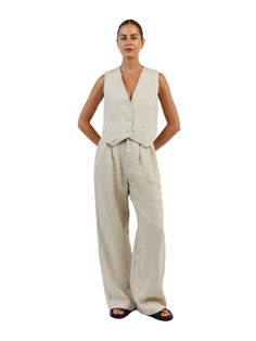 The Sleeveless Linen Vest Pant Set is a timeless ensemble that ties sophistication with comfort. This set is composed of a sleeveless linen vest that boasts a sharp V-neckline and button-down front, paired with coordinating wide-leg pants that offer a relaxed fit. This set encapsulates an effortless elegance, ideal for those who appreciate a minimalist aesthetic with a touch of classic charm! Features: Light & Soft Linen A lightweight textured linen material with soft lining adapts to any style Linen Vest, Vest Set, Linen Material, Pantalon Large, Effortless Elegance, Everyday Dresses, Minimalist Aesthetic, Knit Set, Pant Set