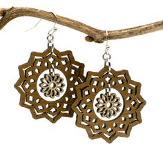 "An intricately cut flower dangles in the center of a mandala to create these boho style earrings. Two tones of wood - walnut and maple - add interest and ensure these earrings will be visible against any hair color. Laser cut wood earrings can be dressed up or down, making them the perfect complement to any outfit! These earrings are strong but so lightweight and comfortable, you will hardly know you have them on! Pair with the matching mandala and flower necklace for a coordinated look: https: Bohemian Brown Flower Jewelry, Brown Flower-shaped Earrings For Gift, Brown Flower Shaped Earrings For Gift, Bohemian Flower-shaped Jewelry With Ear Wire, Bohemian Flower-shaped Pierced Earrings, Bohemian Jewelry With Flower-shaped Matching Earrings, Brown Dangle Flower Earrings For Pierced Ears, Bohemian Jewelry With Matching Flower-shaped Earrings, Bohemian Single Flower Earring