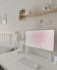 a computer monitor sitting on top of a white desk