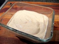 a square glass dish filled with white sauce