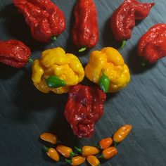 peppers and peanuts arranged in the shape of a face