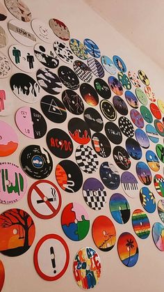 a wall covered in lots of different colored stickers