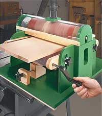 a person is using a machine to make fabric on the loomse in a factory