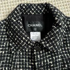 Elegant And Timeless Chanel. Perfect Condition. No Signs Of Wear. Black And White Tweed Boucle Blazer, With Subtly Black Metallic Specs Throughout. Size 36. Fits Xs/S. 2 Subtle Pockets In Front. Black And Silver Monochromatic Buttons Are Also In Perfect Condition. Silk Lining With Monochromatic Flowers. Slight Shoulder Pads. Designer Tweed Outerwear For Business, Luxury White Tweed Jacket For Work, Classic White Wool Tweed Jacket, Designer Black Tweed Jacket, Designer Black Tweed Jacket With Long Sleeves, Designer Black Tweed Long Sleeve Jacket, Monochromatic Flowers, Chanel Jackets, Black White Blazer