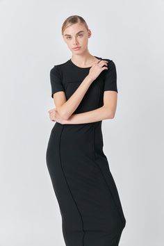 Introducing our stunning Overlock Piping Knit Maxi Dress - the perfect addition to your wardrobe! This dress features a maxi length open back design and short sleeves for a comfortable and stylish look. Its rib neck band adds a unique touch making it stand out from traditional maxi dresses. Made with high-quality fabric and expertly crafted overlock piping this dress provides both comfort and style. Perfect for any occasion whether it's a casual day out or a special event. Upgrade your dress col Black Maxi Dress With Side Slits For Work, Black Short Sleeve Maxi Dress With Side Slits, Black Maxi Dress With Side Slits And Short Sleeves, Sleek Short Sleeve Midi Dress For Summer, Chic Black Short Sleeve Maxi Dress, Bodycon Midi Dress With Short Sleeves And Flattering Silhouette, Modern Black Maxi Dress For Work, Black Short Sleeve Maxi Dress For Work, Short Sleeve Bodycon Maxi Dress For Evening