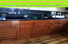 a kitchen with wooden cabinets and black counter tops is shown in this advertment